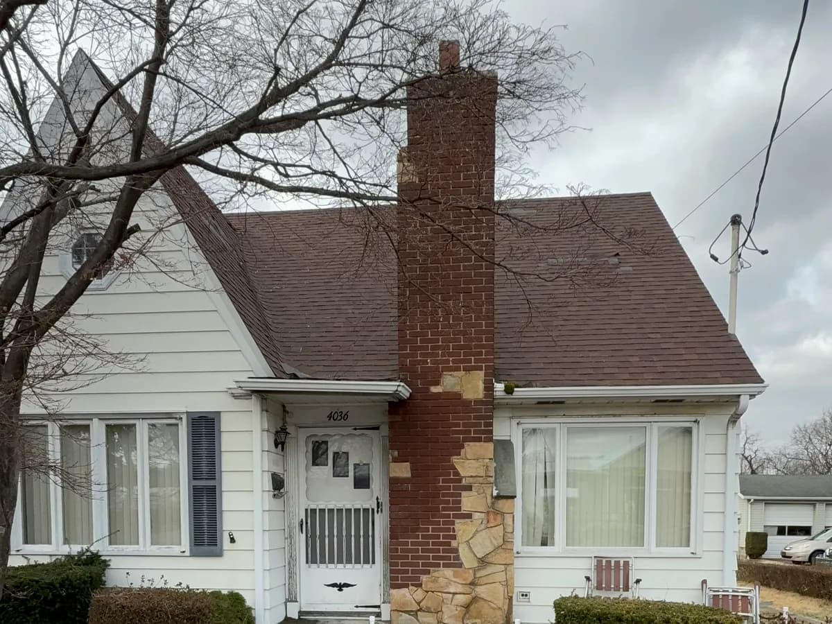 Front exterior of 4036 Birney Avenue in Moosic before House Buying Solutions PA renovated the property