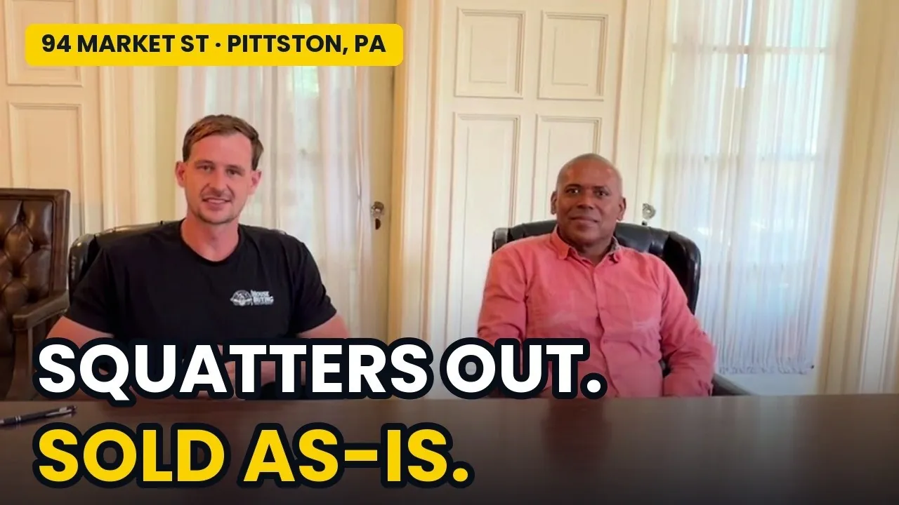 Jake Arnold and local buyer partner Manny at the table for 94 Market Street in Pittston, labeled squatters out, sold as-is